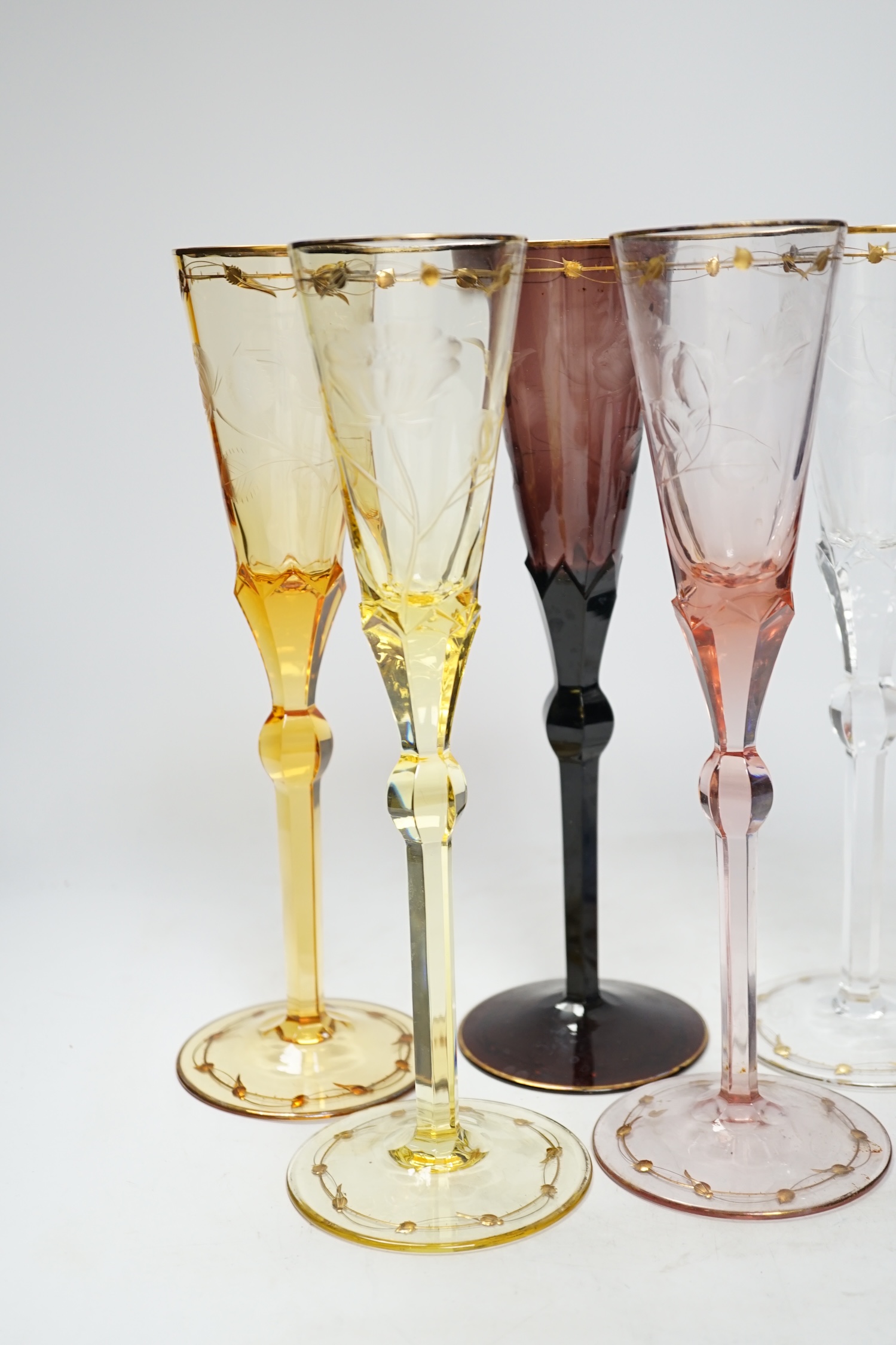 A set of six coloured Moser engraved and gilt enamelled, champagne flutes, 27cm high